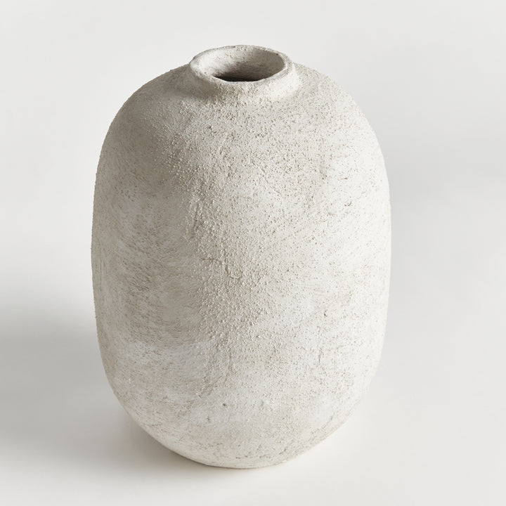 Angled view of large gray terracotta vase showing textured surface, rounded form, and artisan terracotta finish – Transitional