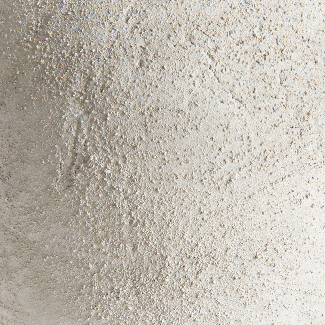 Close-up of textured gray terracotta vase surface showing handcrafted finish and natural artisanal variation – Transitional