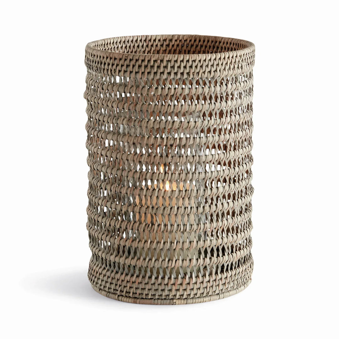 Large graywash handwoven rattan hurricane candleholder with an open cylindrical body and glass insert, on white, Transitional