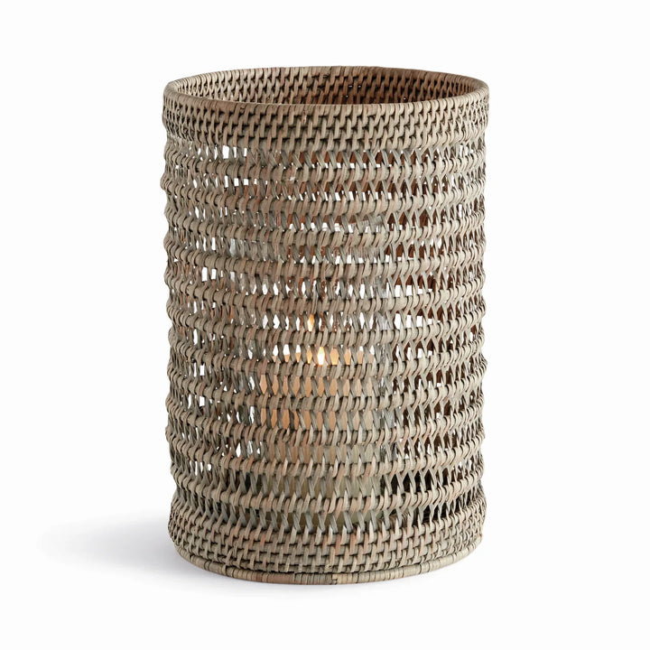 Large graywash handwoven rattan hurricane candleholder with an open cylindrical body and glass insert, on white, Transitional