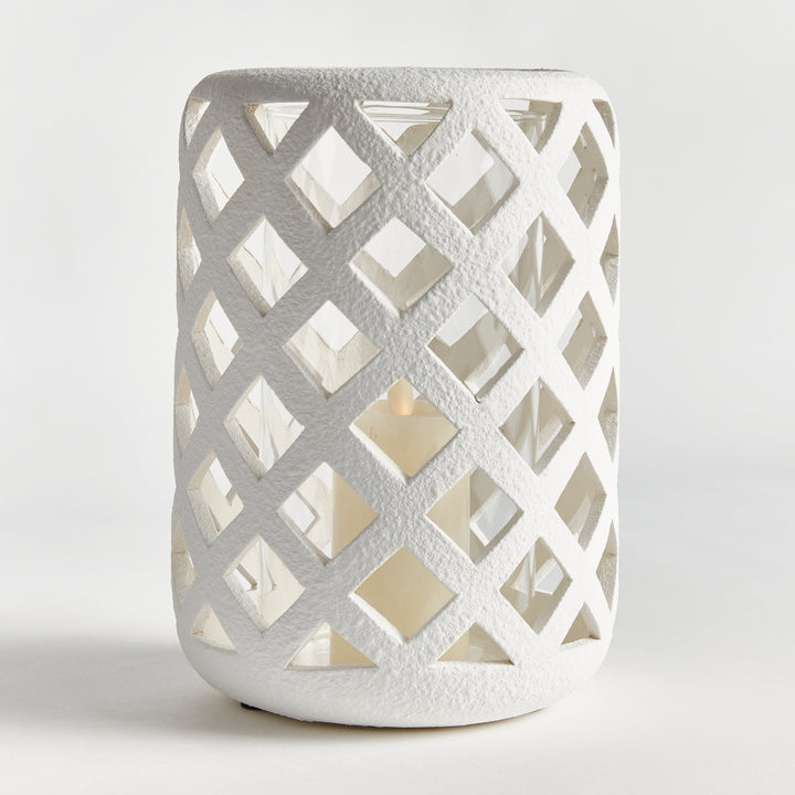 Close-up of large moss terracotta hurricane candle holder with textured lattice detailing – European Rustic style.
