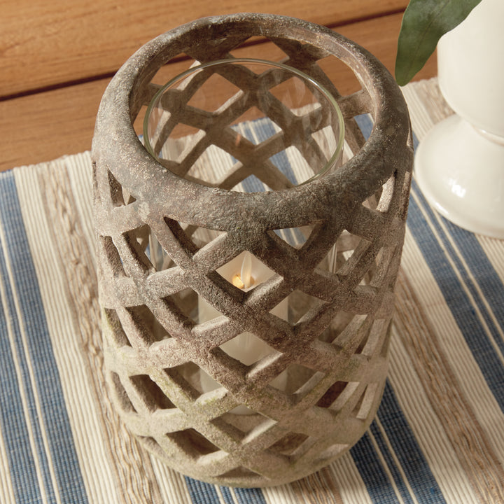 Front angled view of large moss terracotta hurricane candle holder with lattice detailing – Organic Transitional style.