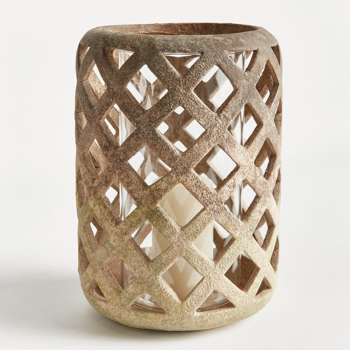 Single large moss terracotta hurricane candle holder with textured lattice cutouts and clear glass insert – Rustic Transitional style.