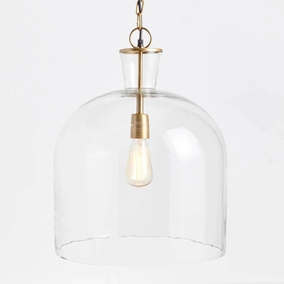 Angled view of large clear glass bell pendant shade, showing curved shoulders and brass-finished fittings, Transitional style