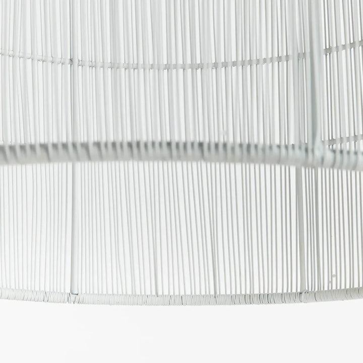 Large white woven iron pendant shade close-up showing slim metal strands and horizontal rings at the lower rim, Coastal style
