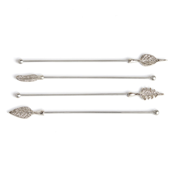 Laurel set of four silver stainless steel swizzle sticks with assorted leaf-shaped tops on a pale background. Transitional