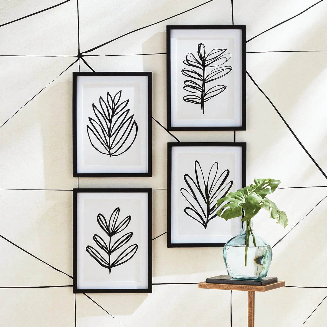 Framed black botanical sketch prints styled on geometric wall – modern minimalist art set of 4
