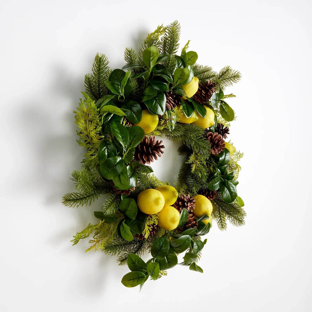 Artificial lemon wreath with pinecones and cedar foliage – angled overhead perspective