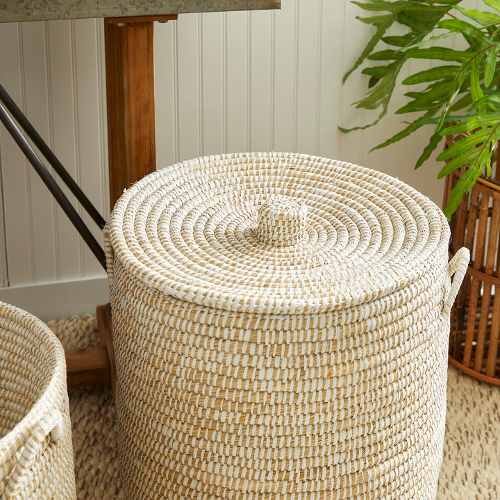 Lidded rivergrass hamper basket styled near woven rug and greenery for natural home organization use – Coastal Organic.