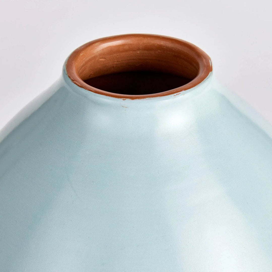 Close-up of light blue ceramic vase neck and shoulder with terracotta-brown interior detail – Modern Organic.