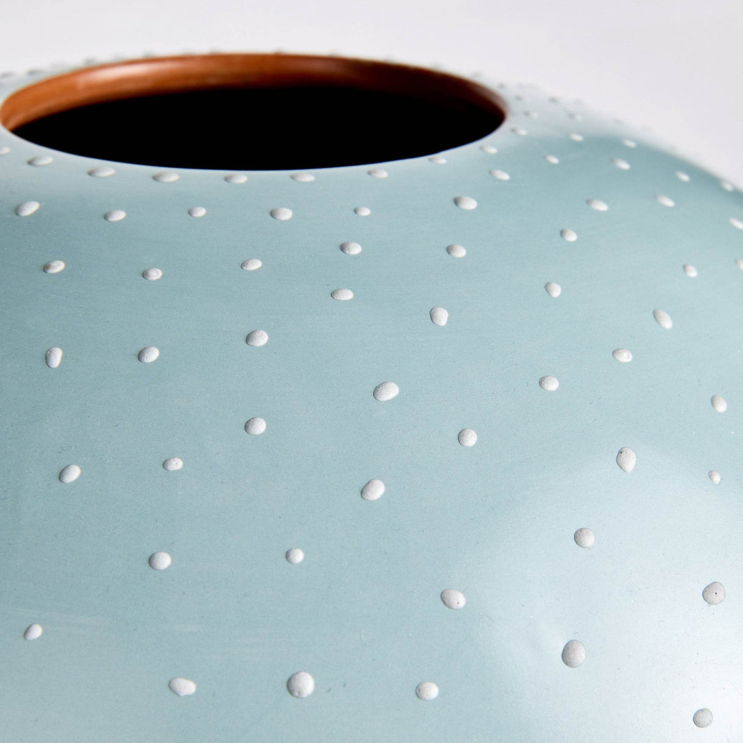Detail of stippled surface on matte light blue ceramic vase showing hand-applied white dot texture – Modern Organic.

