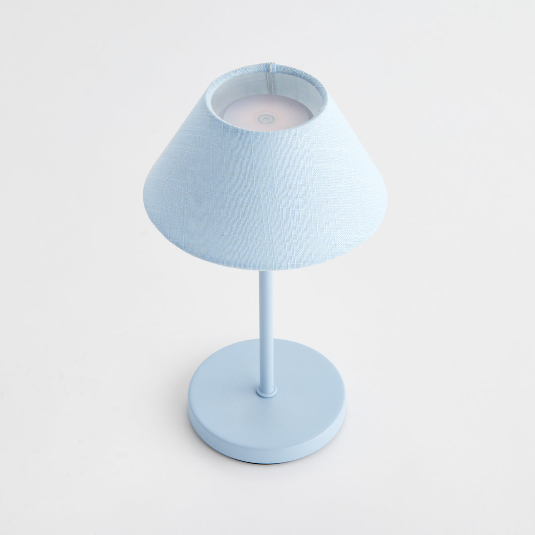 Top view of light blue cordless LED table lamp showing touch control surface and linen empire shade – Coastal Transitional