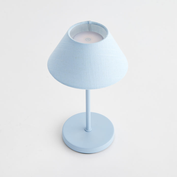 Top view of light blue cordless LED table lamp showing touch control surface and linen empire shade – Coastal Transitional