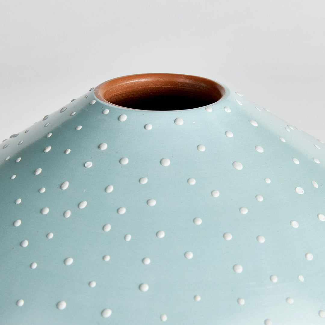 Close-up of white stipple dots on the light blue ceramic surface, showing handmade detail and smooth matte finish – Modern Organic.


