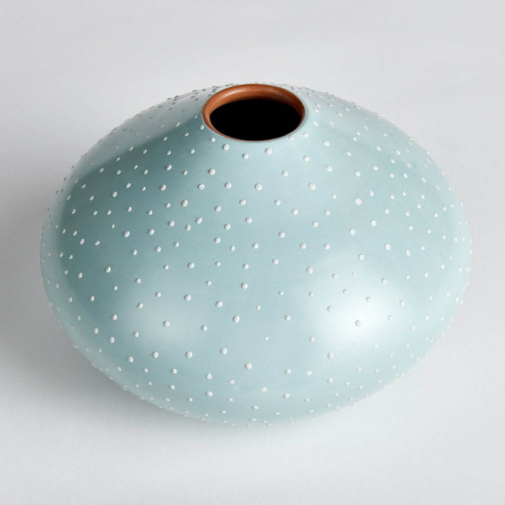 Top-down angle of light blue ceramic vase highlighting the narrow opening and hand-applied stipple texture – Modern Organic.


