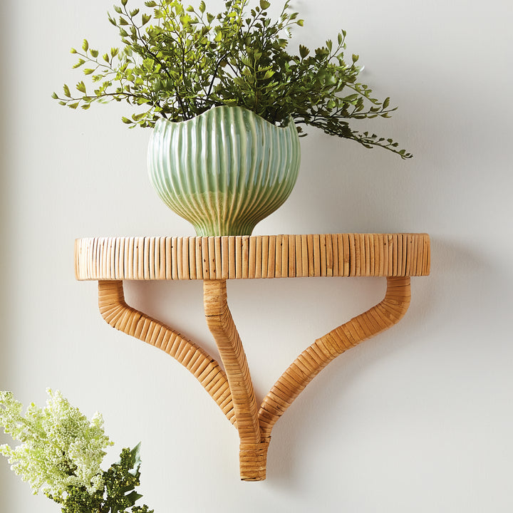18-inch artificial maidenhair fern in a green fluted pot on a woven wall shelf, with fine fronds above the rim. Transitional