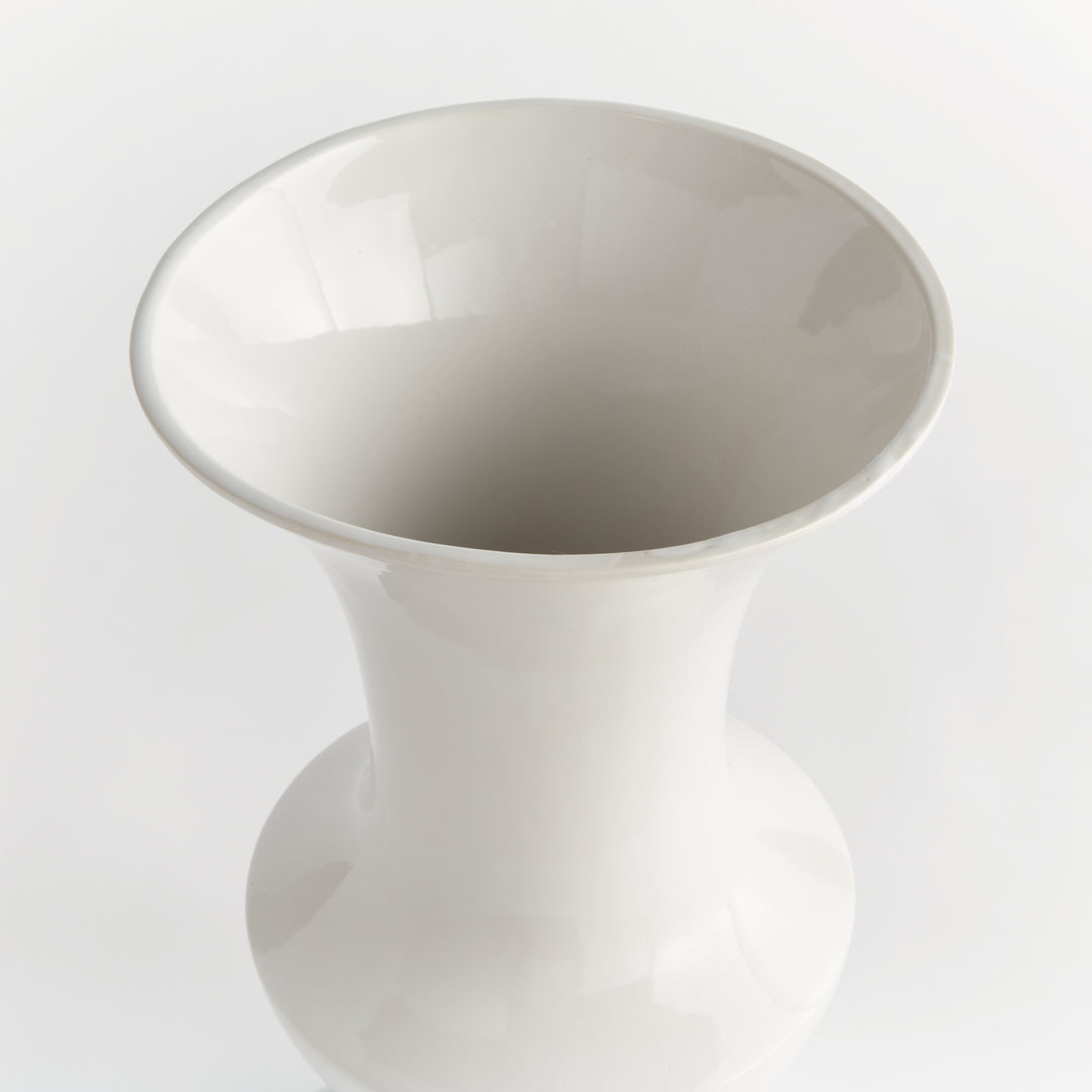 Overhead view of a large white ceramic trumpet vase with an open flared rim and smooth interior, shown in Traditional style