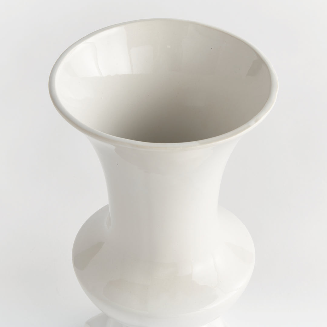 Angled overhead view of a medium white ceramic vase showing the flared rim and smooth glazed interior in Traditional style