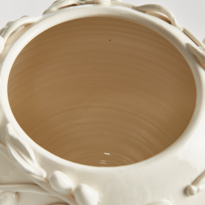 Overhead view inside a ceramic vase showing its unglazed interior, throwing rings and white olive relief rim. Traditional