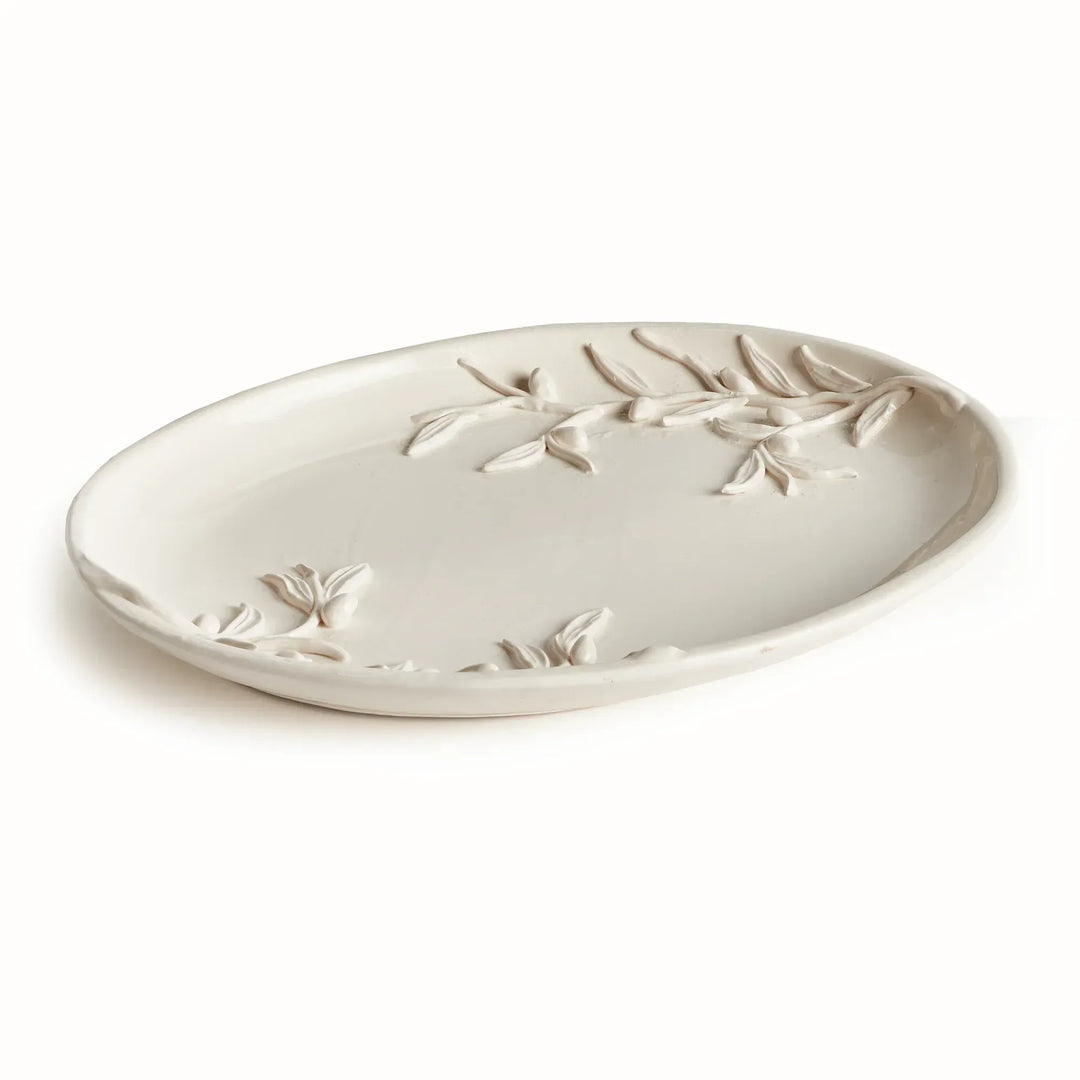 White ceramic tray with an oval outline, shallow rim and raised olive branches across its glazed surface. Classic Traditional