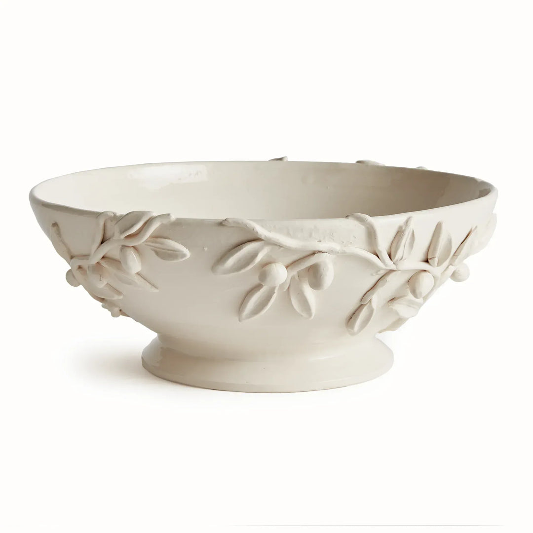 White ceramic footed bowl with a broad opening, pedestal base and handmade olive branch relief around the sides. Traditional