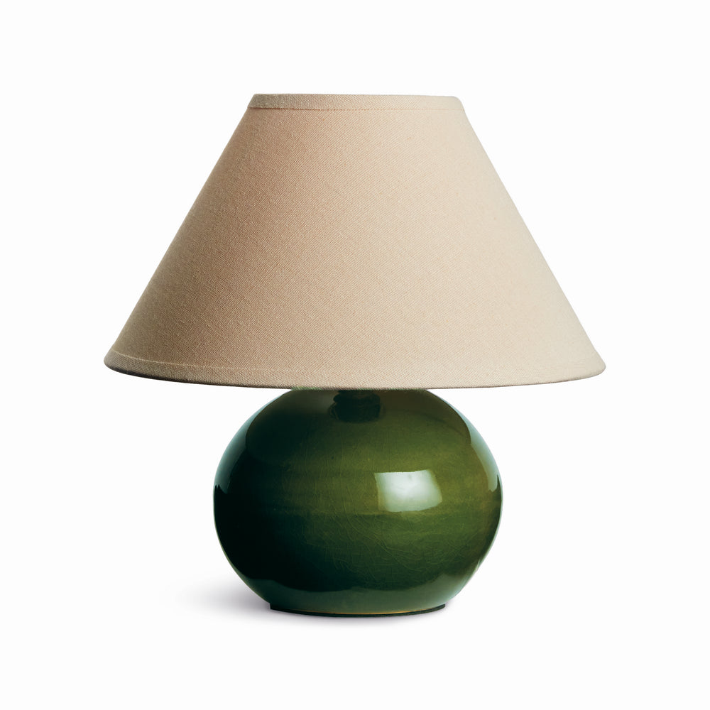 Green mini ceramic table lamp with linen shade and glossy ceramic base on white background modern accent lighting style