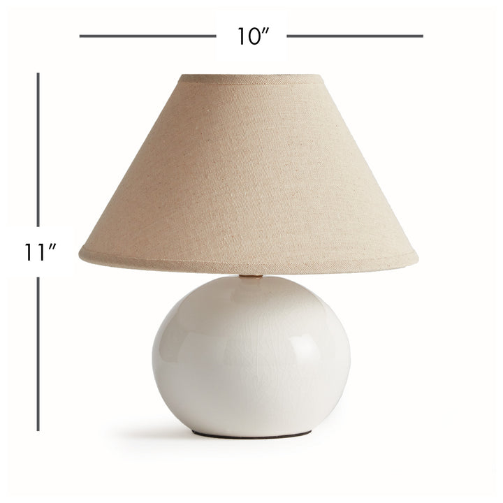 White mini ceramic table lamp with linen shade shown with product dimensions on white background modern accent lighting style