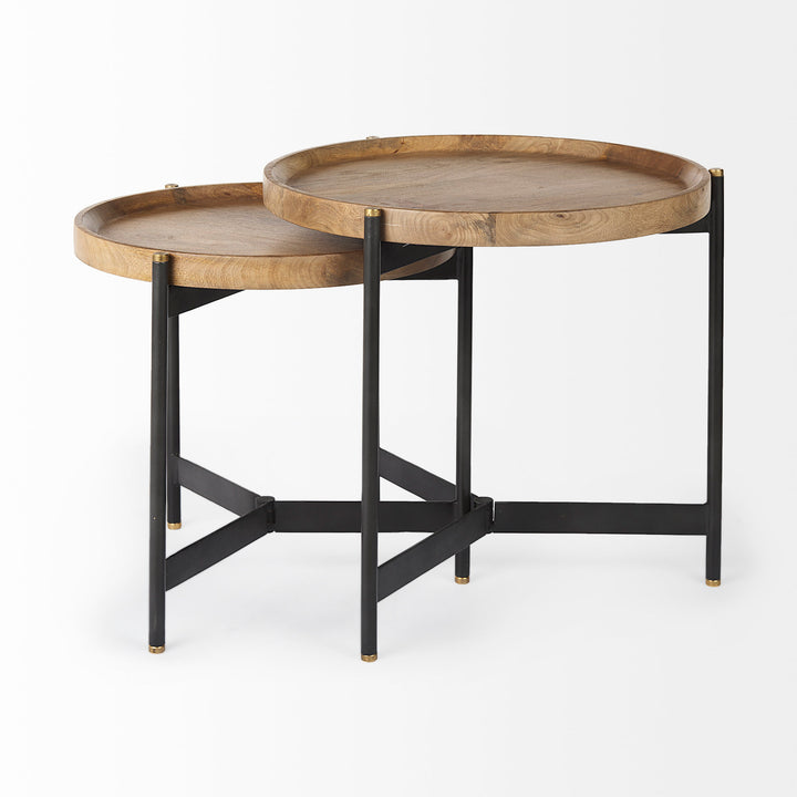 Round mango wood nesting side tables displayed apart with black iron bases and raised tray edges – Modern Organic