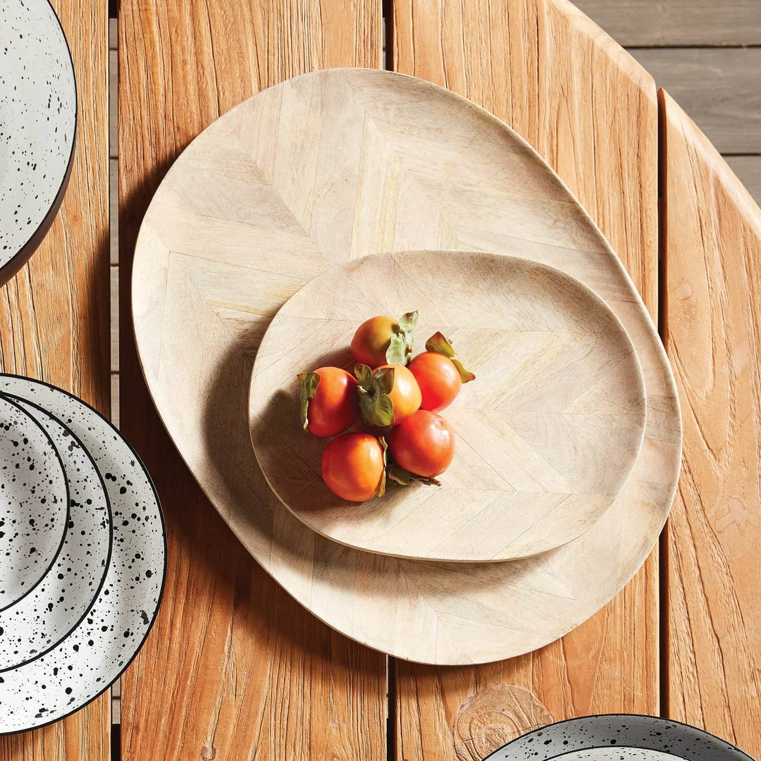 Mango wood oval serving trays set styled on wood table with fruit, perfect for farmhouse and modern organic kitchen decor.

