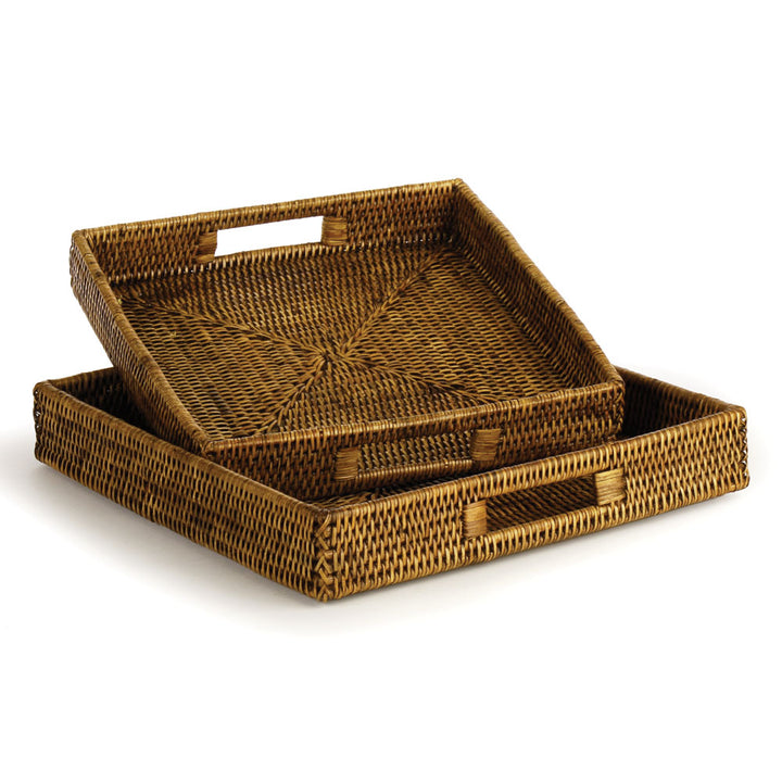 Two square brown rattan trays with cutout handles, shown together with their woven interiors visible - Coastal Transitional