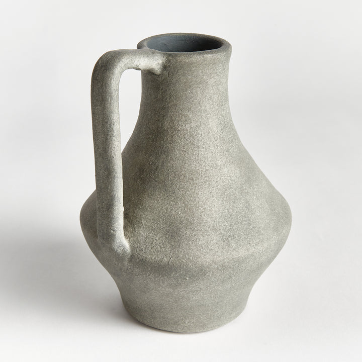 Rear view of gray terracotta jug vase showing its long neck, straight handle and textured rounded lower body. Modern Organic