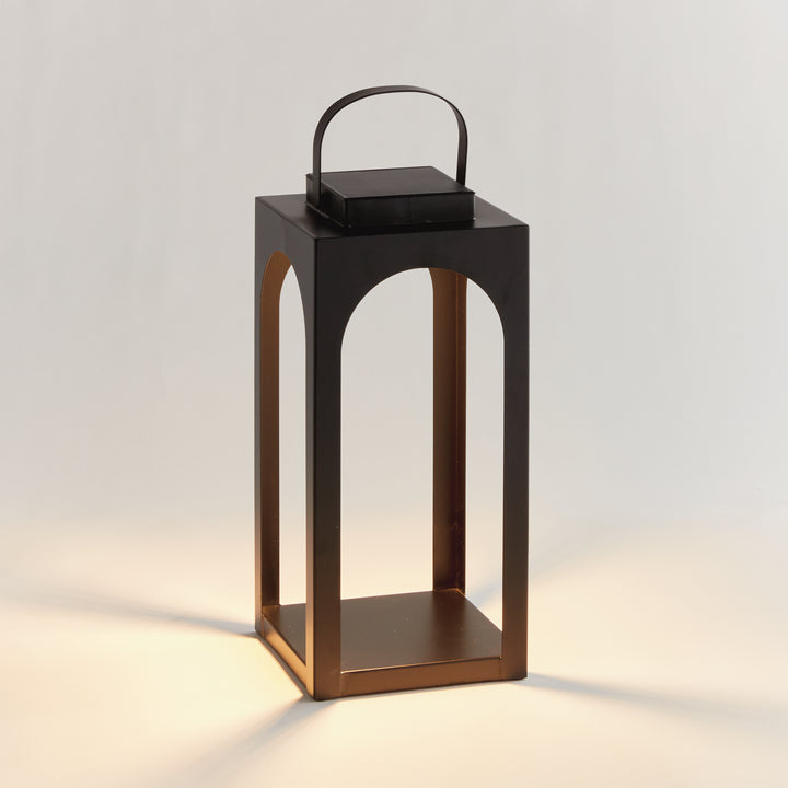 Matte black modern arched solar LED outdoor lantern with powder-coated metal frame and warm 3000K illumination in an 18-inch height – Transitional