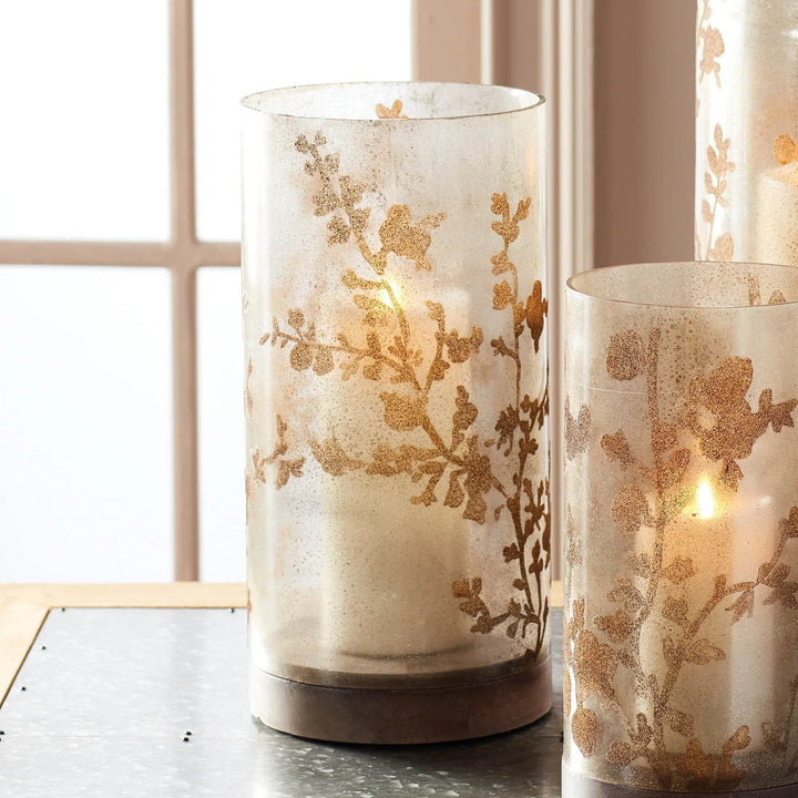 14-inch glass candle holder with etched vine motif shown beside large and small versions in layered grouping – Modern Natural style