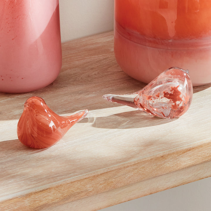 Melon glass bird sculptures set of two with hand blown detailing, compact decorative accents for shelves and tables.