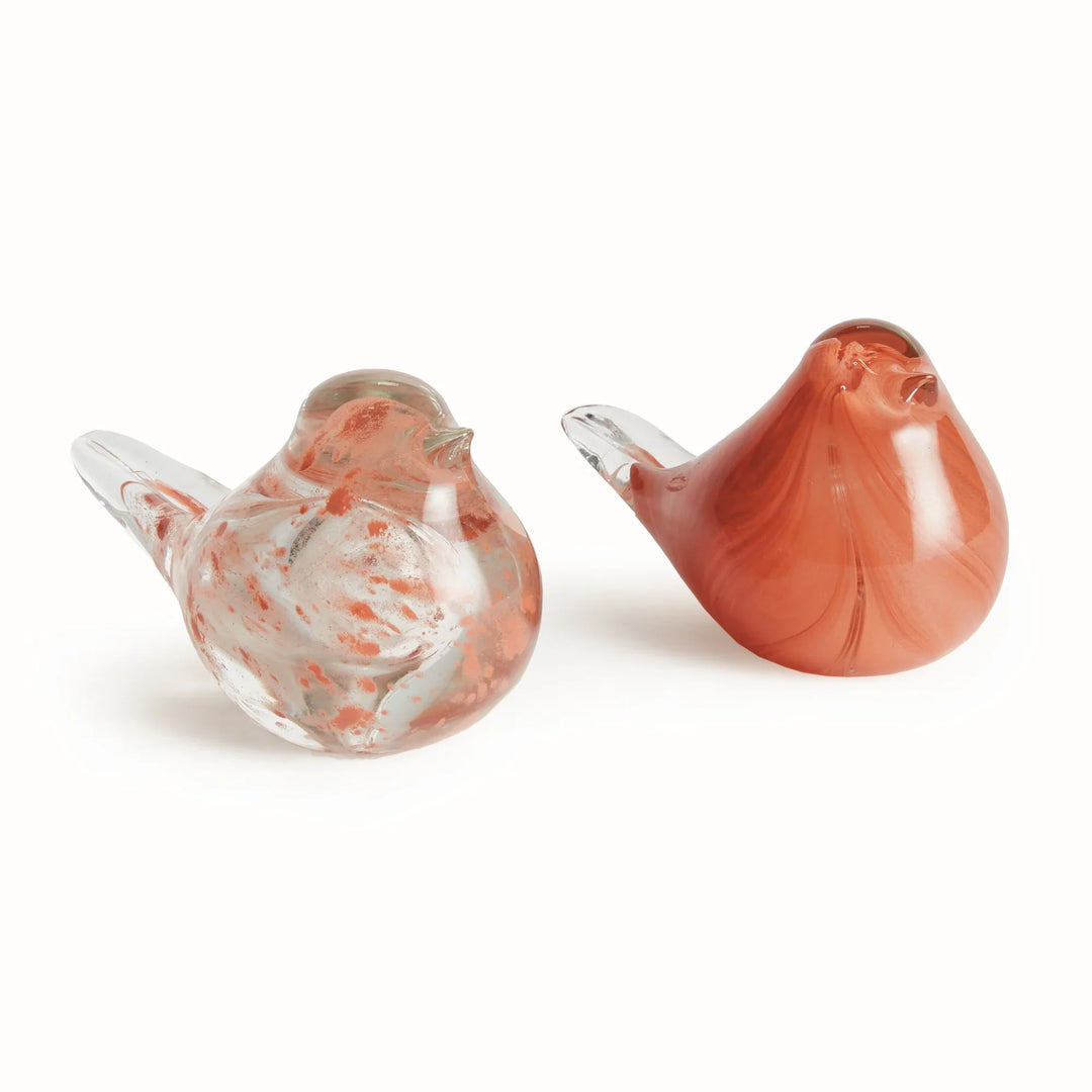Pair of hand blown melon glass finch sculptures showing translucent and speckled finishes as decorative bird accents.