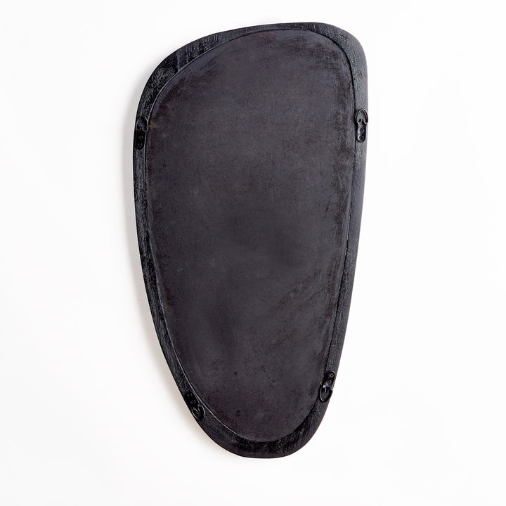Back view of mid-century modern asymmetrical wall mirror showing dark finish and integrated hanging hardware.

