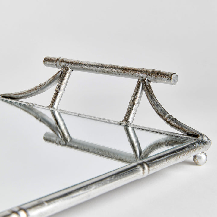 Handle detail of mirrored tray with antique silver finish, bamboo-inspired design, modern classic accent

