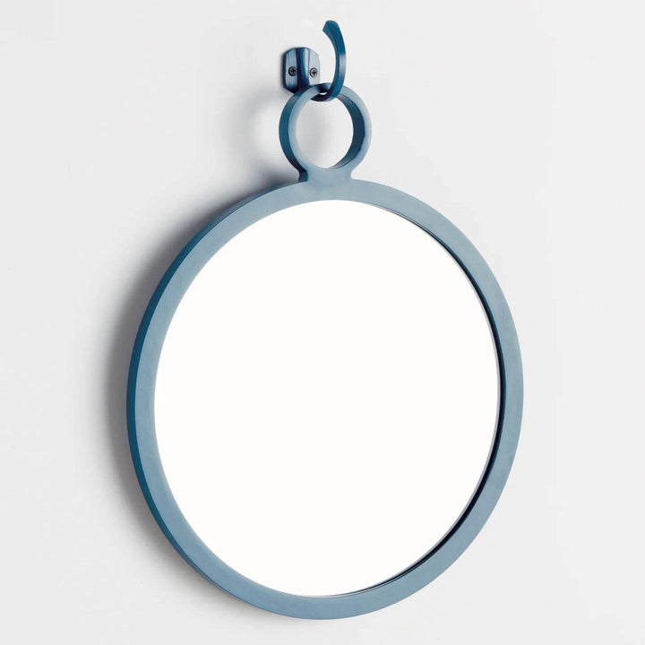 Side angle view of round blue wall mirror with sleek hook—adds sculptural detail to modern coastal décor
