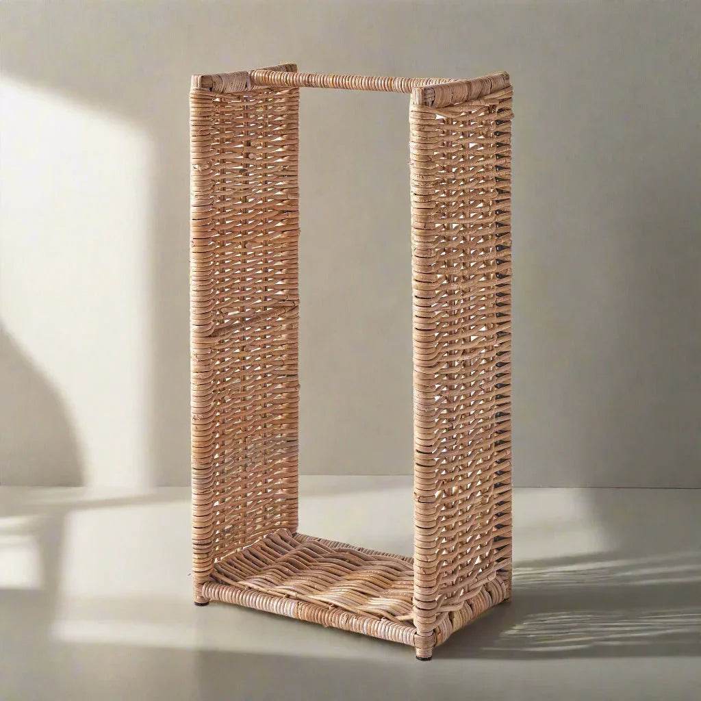 Tall rattan firewood holder with open sides in soft studio light, modern farmhouse wood storage design