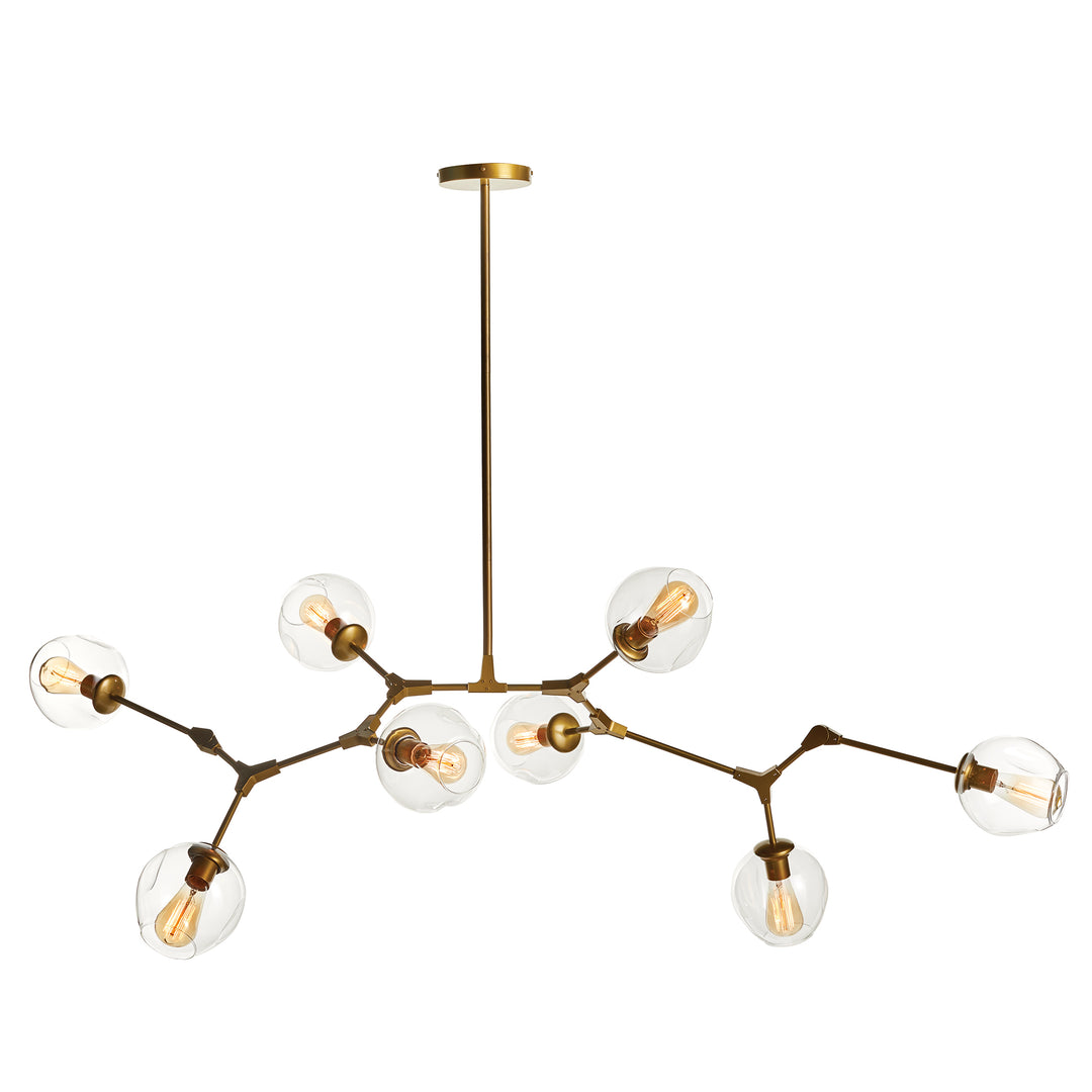 Clean product view of modern brass chandelier with eight clear globes and matte brass finish.