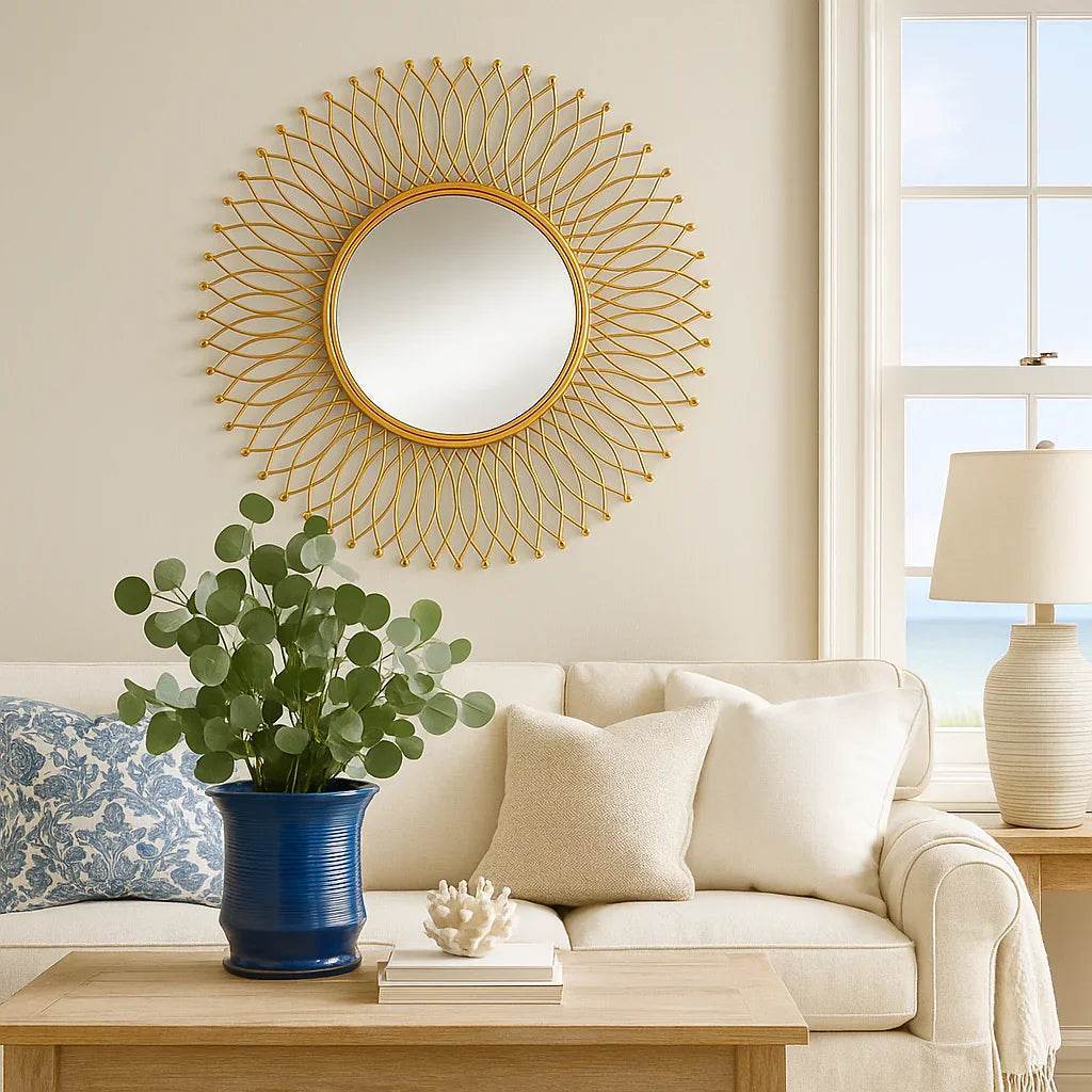 Coastal living room with a modern gold mirror as focal point above console, styled in warm natural tones and soft textures.