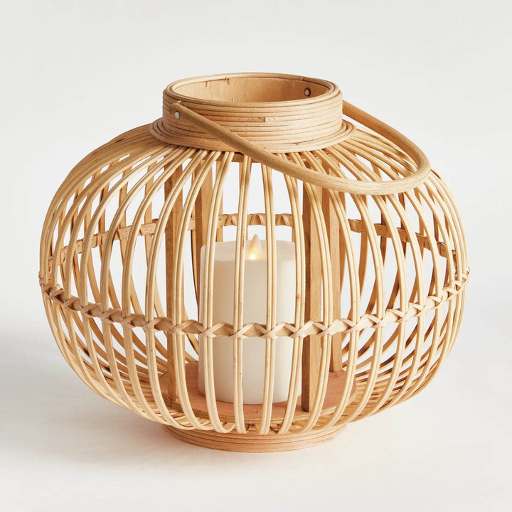 Side view of coastal boho rattan lantern with natural bamboo frame and flameless candle

