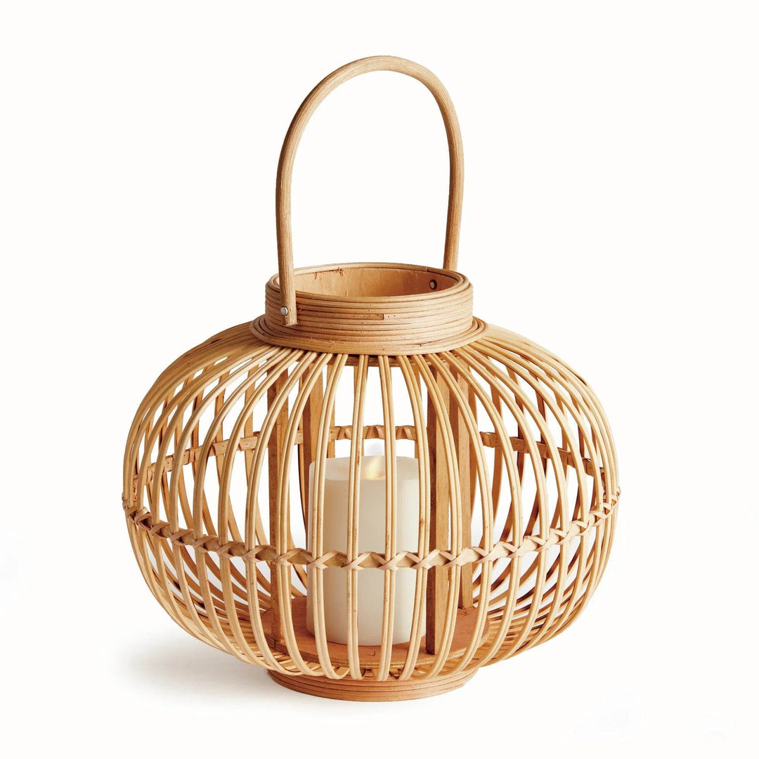 Modern natural rattan lantern shown with upright handle, ideal for boho and coastal home decor

