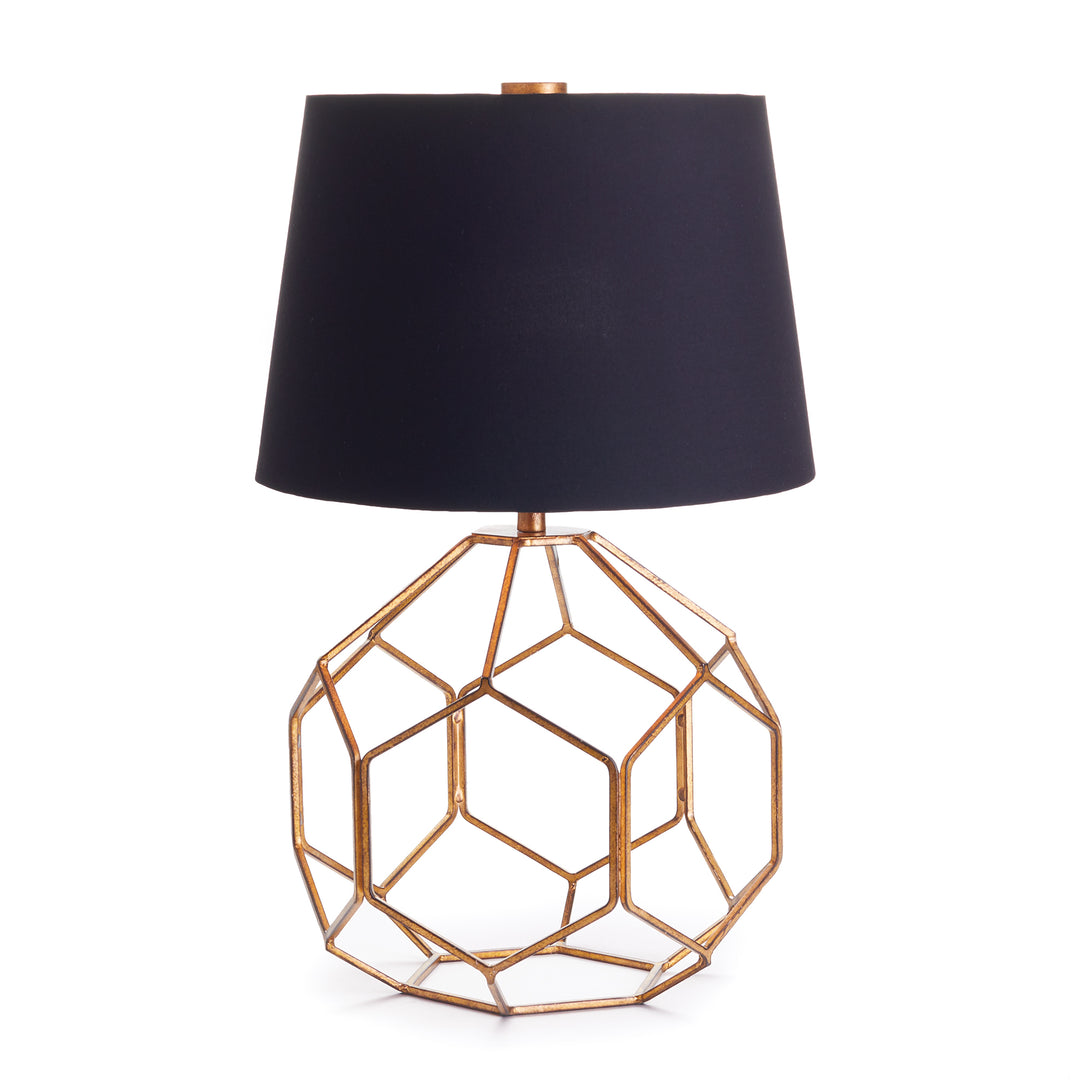 Modern table lamp with black shade and antique gold base on white background
