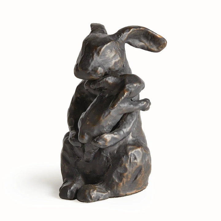 Black mother rabbit sculpture with bronze undertones holding baby, sculpted aluminum tabletop accent with expressive form, rustic decor