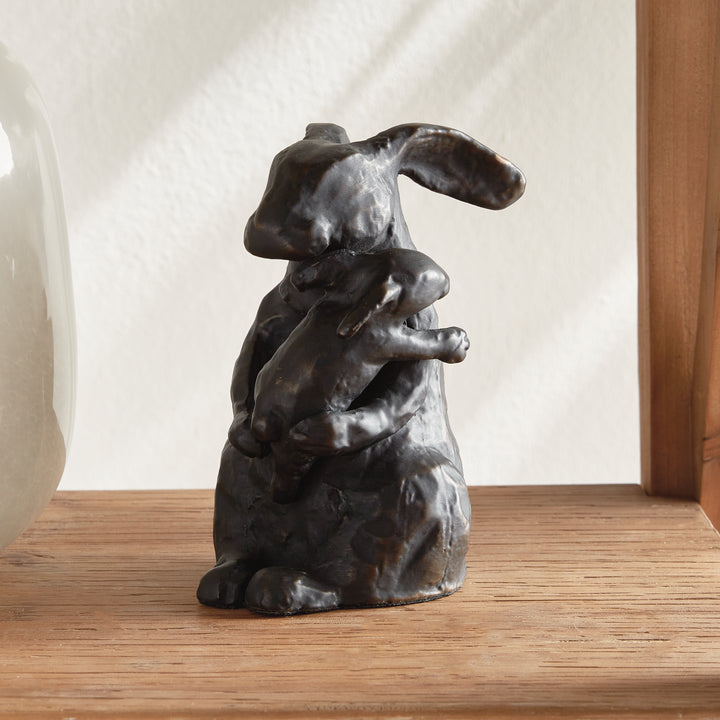 Side view of black mother rabbit sculpture with bronze undertones, aluminum animal accent showing sculptural depth, rustic decor