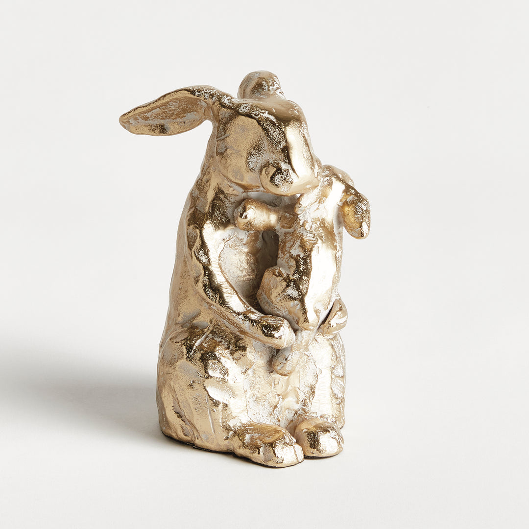 Back view of white ash gold mother rabbit sculpture with baby, aluminum animal decor showing sculptural form, rustic decor