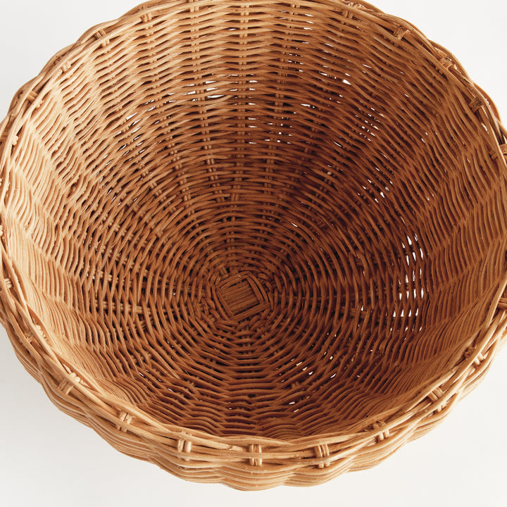 Natural rattan footed bowl viewed from above, showing its wide open interior and circular woven base - Coastal Transitional