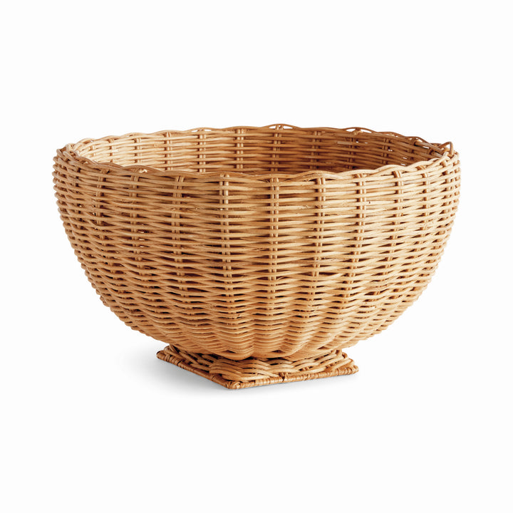 Natural rattan footed bowl with a rounded woven body and square pedestal, shown empty on plain white - Coastal Transitional