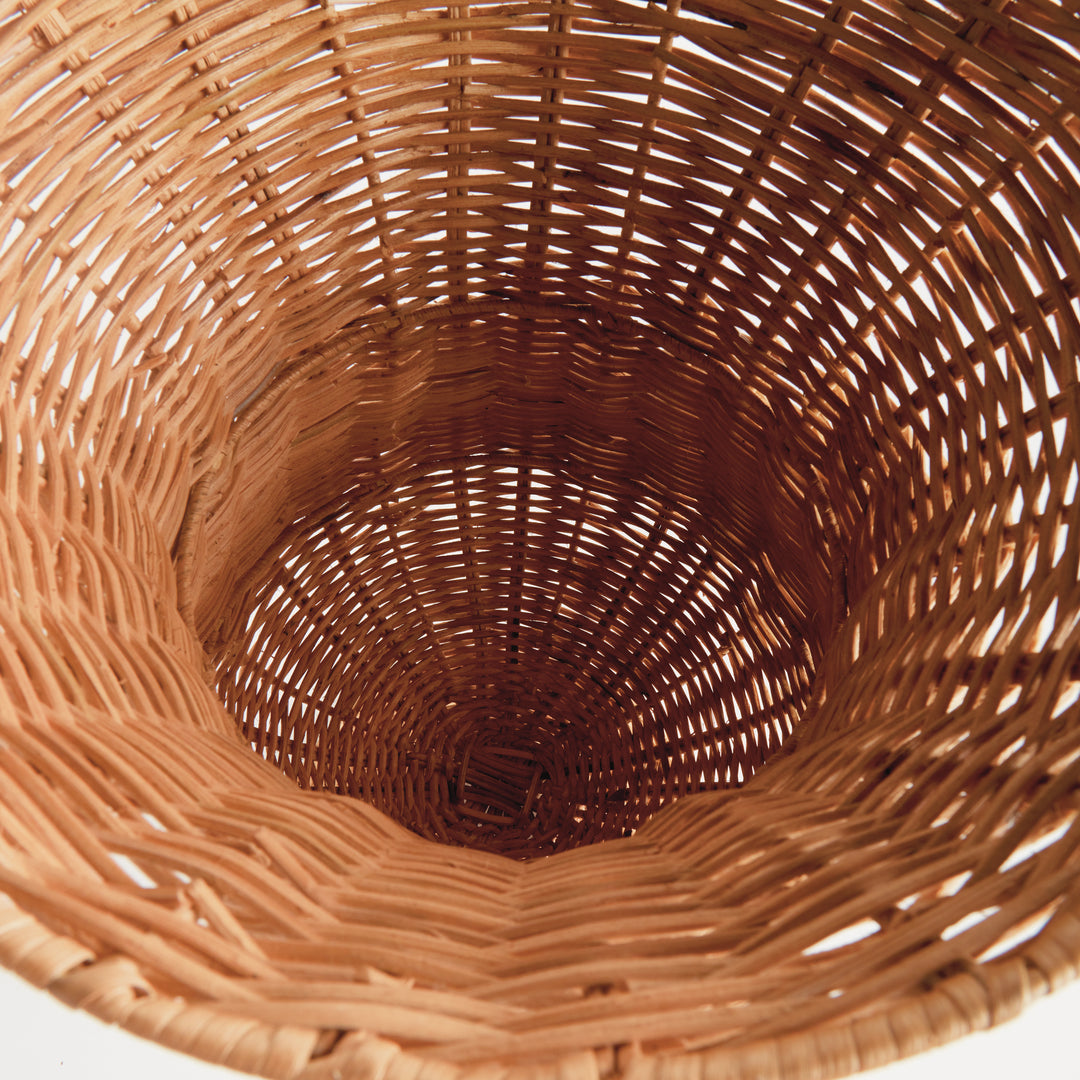 Top view of the natural handwoven rattan footed urn displaying the woven interior and artisan construction – Coastal.